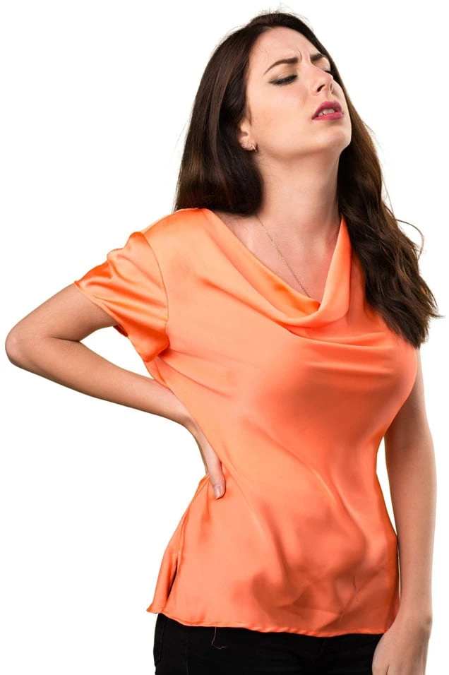 A woman holding her lower back in pain